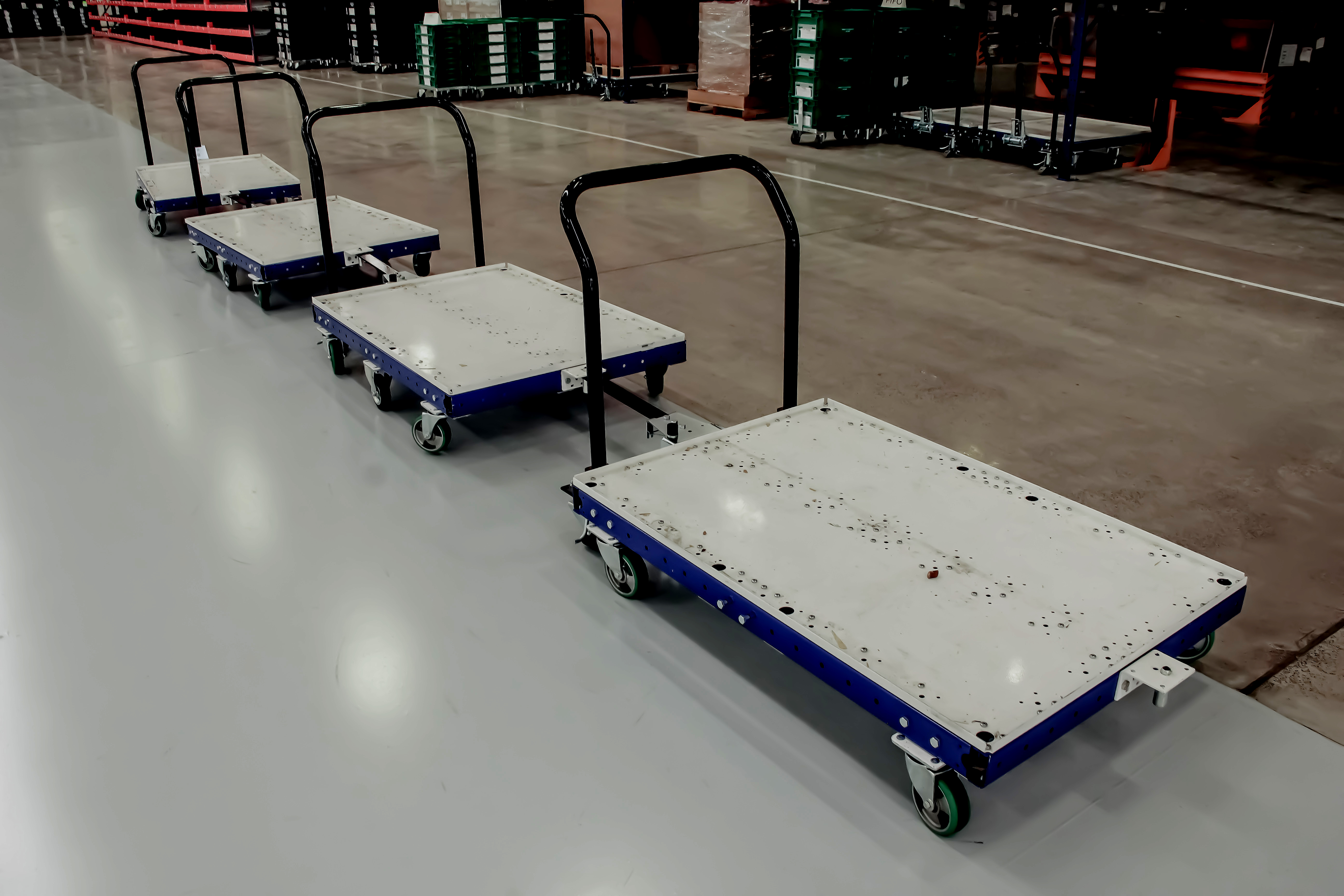 FlexQube pallet carts in a tugger train
